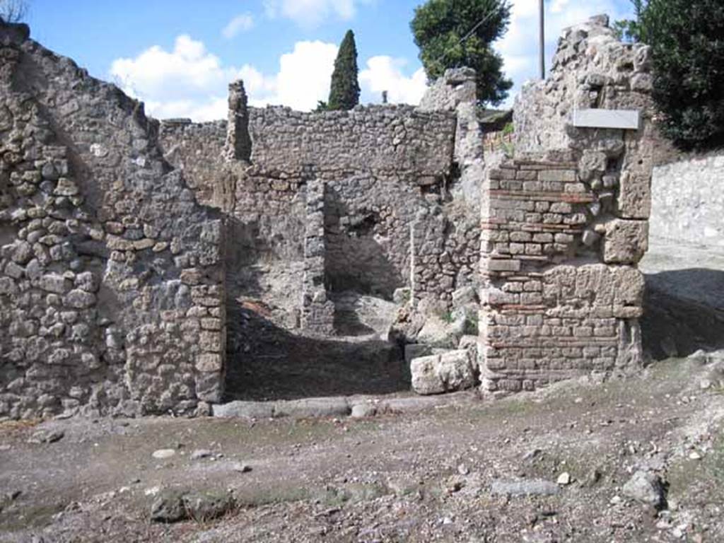 I.2.23 Pompeii. September 2010. Looking north to entrance doorway, from across Vicolo del Conciapelle. Photo courtesy of Drew Baker.
