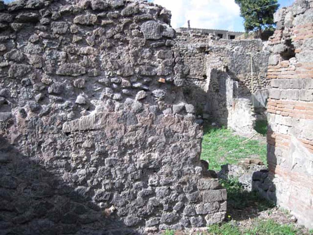 I.2.24 Pompeii. September 2010. North wall of large room and doorway in north-east corner, into the south side of atrium. Photo courtesy of Drew Baker.