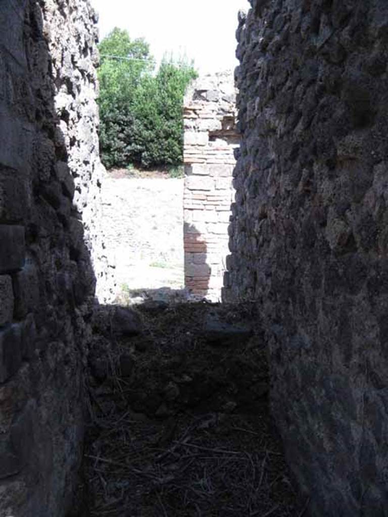 I.2.24 Pompeii. September 2010. Looking east into space in small room below the stairs. Photo courtesy of Drew Baker.