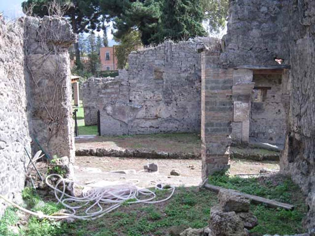 I.2.25 Pompeii. September 2010. Looking south across caupona, from rear.
Photo courtesy of Drew Baker. According to Fiorelli, this caupona was very ruined when excavated. On the left of the photo would have been a hearth, and on the right, near the wall would have been a cistern-mouth for the well. See Pappalardo, U., 2001. La Descrizione di Pompei per Giuseppe Fiorelli (1875). Napoli: Massa Editore. (p.37)
