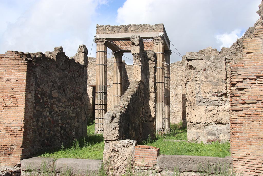 I.2.27 Pompeii, on right. October 2024. 
Looking north in Vicolo del Conciapelle, with entrance to I.2.28, on left. Photo courtesy of Klaus Heese.