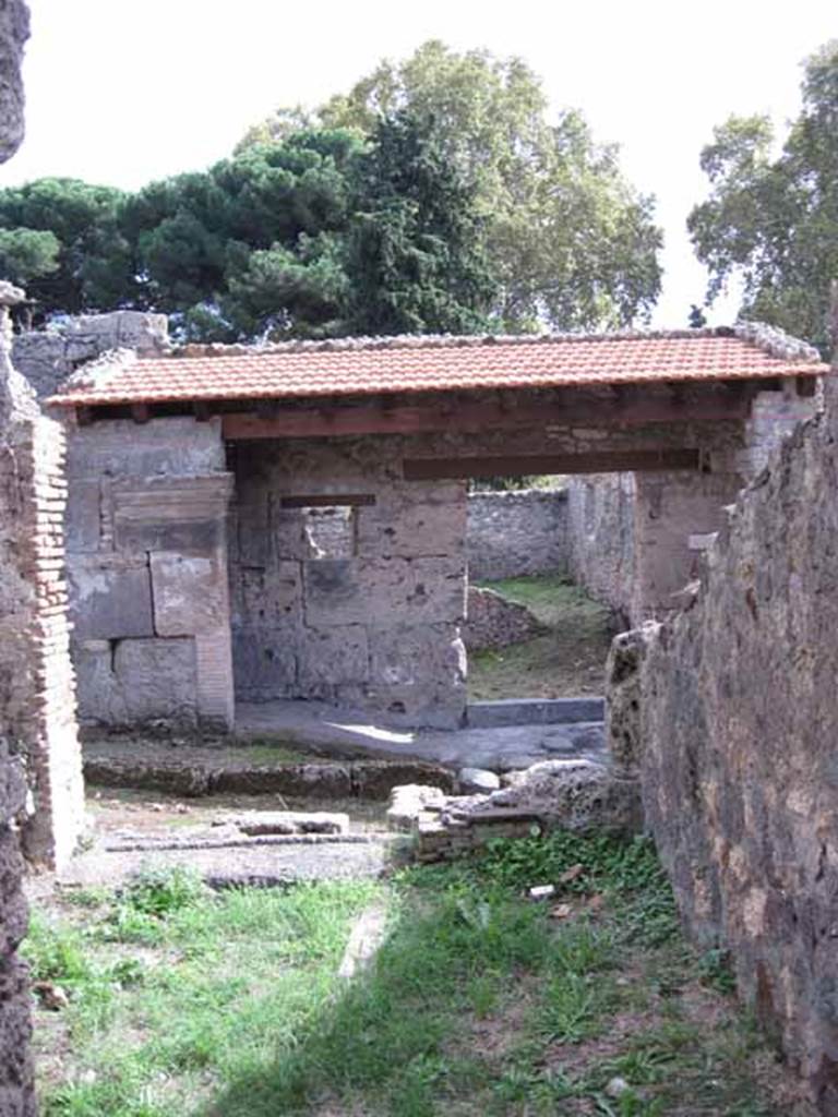 I.2.27 Pompeii. September 2010. Looking south towards entrance doorway and Vicolo del Conciapelle, from rear. Photo courtesy of Drew Baker.