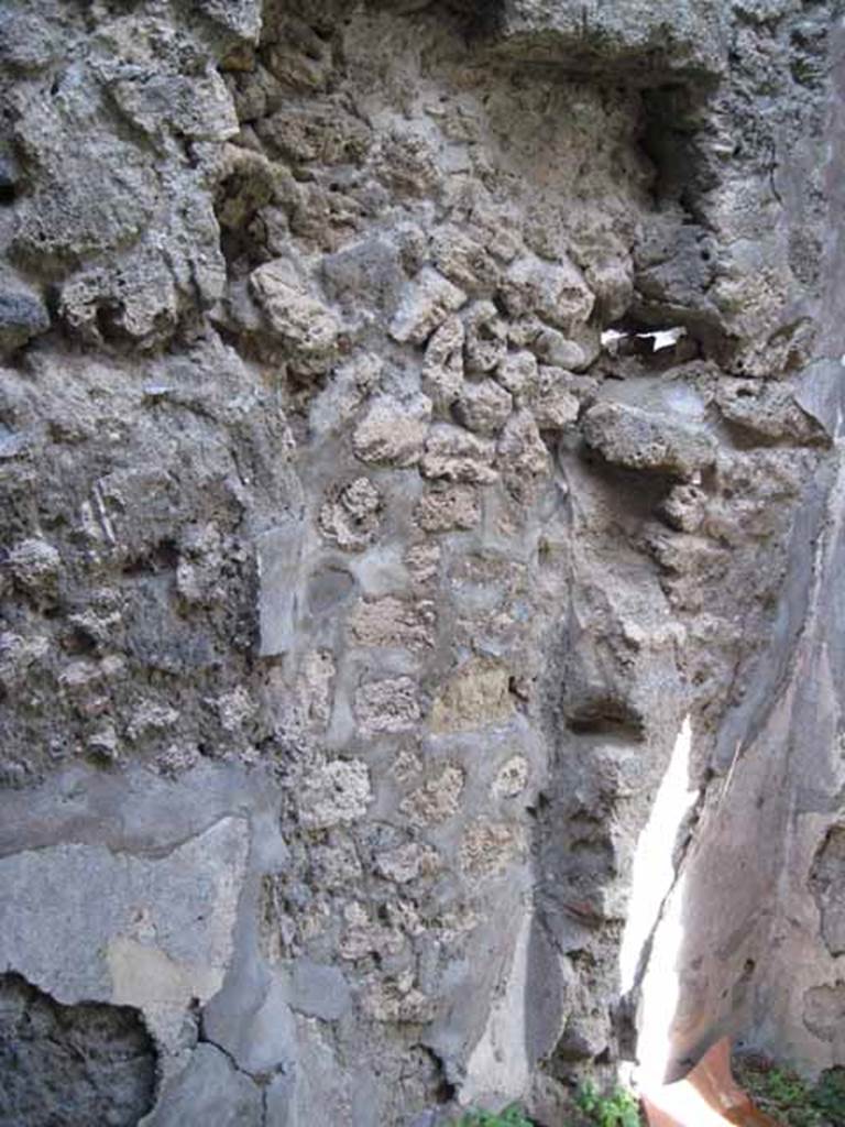 I.2.28 Pompeii. September 2010. East wall of cubiculum in north-east corner of atrium, with blocked doorway. Photo courtesy of Drew Baker.