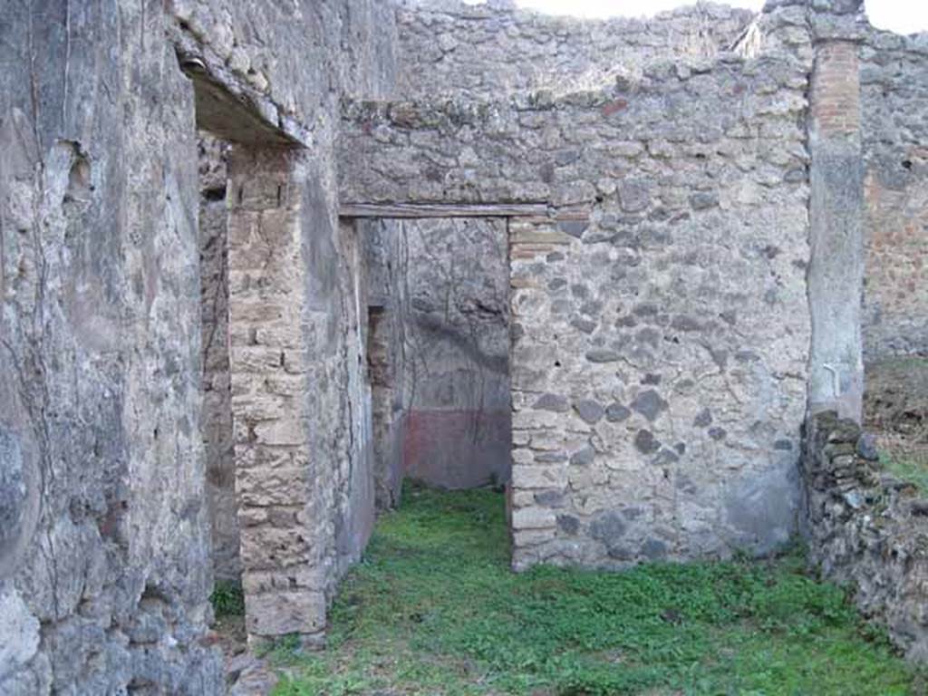 I.2.28 Pompeii. September 2010. Looking west across south portico, towards doorway to small room on south side of triclinium. Photo courtesy of Drew Baker.  The doorway on the left leads from the tablinum. 
According to Jashemski, the wall on the right would have had an entrance through the wall into the garden opposite the tablinum doorway.  See Jashemski, W. F., 1993. The Gardens of Pompeii, Volume II: Appendices. New York: Caratzas. (p.25)