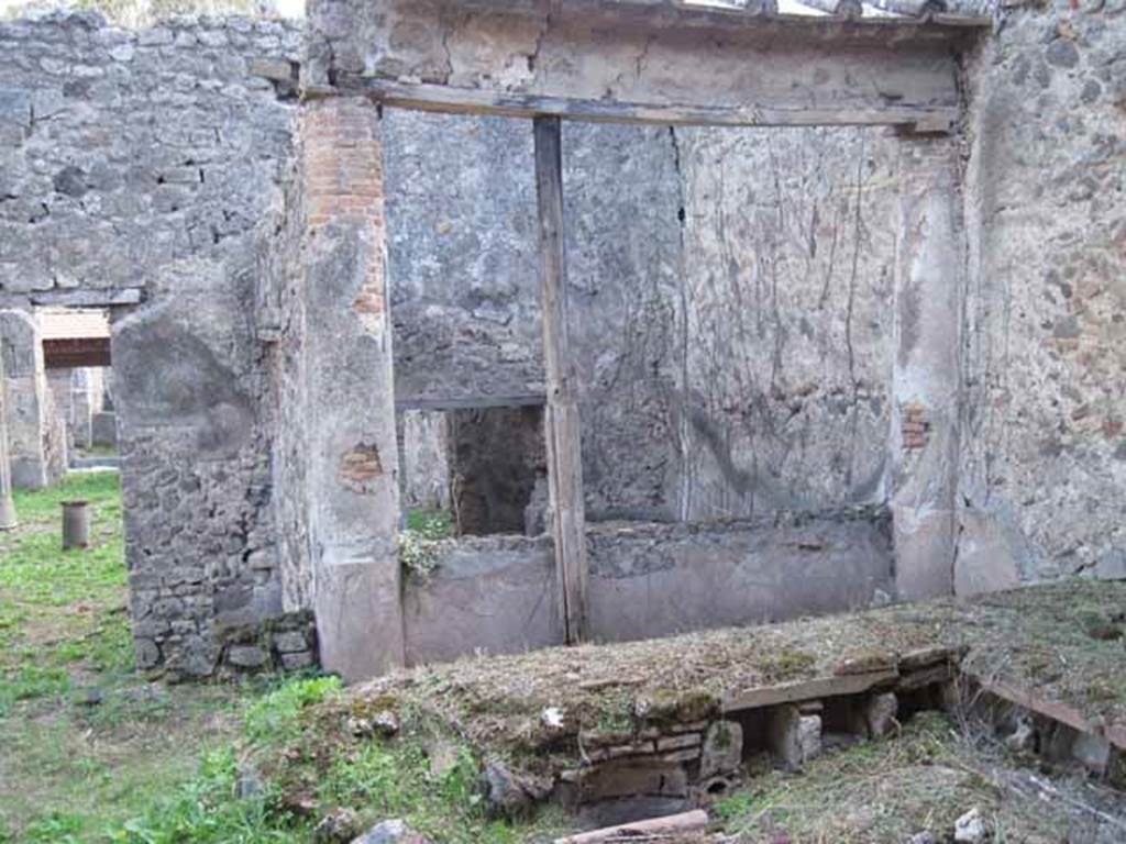 I.2.28 Pompeii. September 2010. South wall of triclinium area with window to room overlooking it. Photo courtesy of Drew Baker.