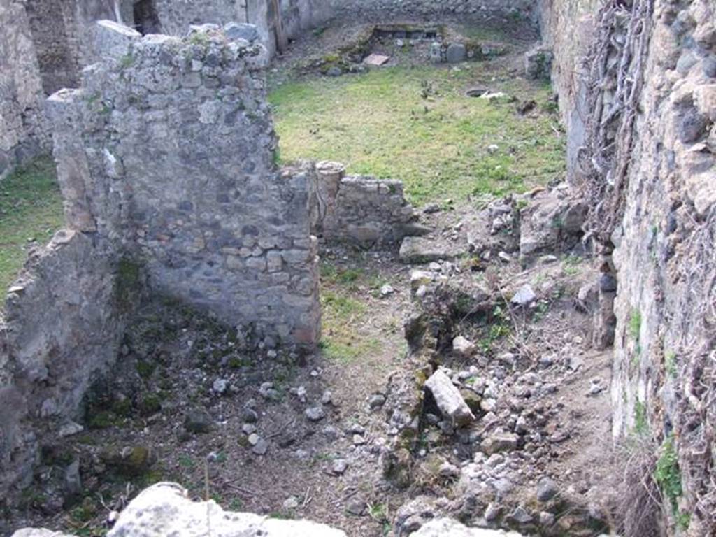 I.2.28 Pompeii.  March 2009.  Looking west above Kitchen area.  Taken from I.2.20.   According to Fiorelli, this comprised “an ample hearth, two rooms as cells, the latrine, a staircase to the floor above, and at the back of the portico a cupboard between two small masonry walls”.  See Pappalardo, U., 2001. La Descrizione di Pompei per Giuseppe Fiorelli (1875). Napoli: Massa Editore. p.38