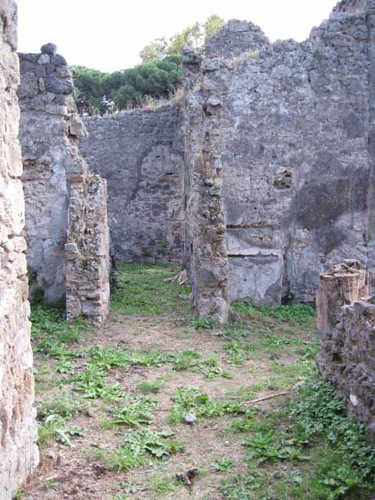 I.2.28 Pompeii. September 2010. Looking south along east portico from doorway from kitchen area. Looking towards corridor on east side of atrium and doorway to large triclinium, on left. Photo courtesy of Drew Baker.