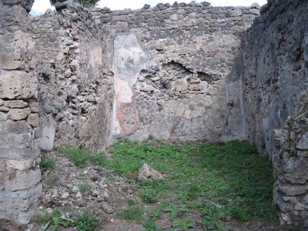 I.2.28 Pompeii. September 2010. Looking east into large triclinium on east side of portico. Photo courtesy of Drew Baker. According to Fiorelli, this room was adorned with paintings, of which two were saved. One of a big country scene with pastoral sacrarium and goats. The other showing Cassandra and Hector predicting the ruin of Troy to Priam, caused by the young boy Paris. Paris is leaning against the King’s knee holding an apple. See Pappalardo, U., 2001. La Descrizione di Pompei per Giuseppe Fiorelli (1875). Napoli: Massa Editore. (p.37 and black and white drawing)
According to Sogliano, paintings found in the triclinium were –
Amore and Psiche at the hunt, on a black background, and Eros at the hunt, on a black background (p. 64, nos. 374 and 375).
Prophecy of Cassandra. Now in Naples Archaeological Museum: 111476.This was found damaged at the upper corner (p.105, no.560).  
Landscape: the scene represented a valley between high mountains (p.141, no.684)
See Sogliano, A., 1879. Le pitture murali campane scoverte negli anni 1867-79. Napoli: (pages, as above)