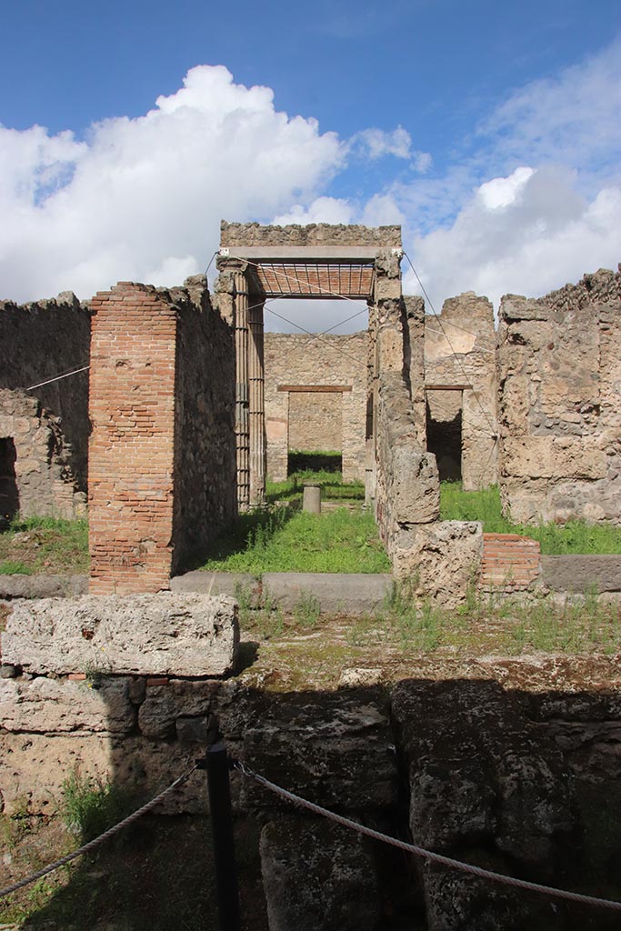 I.2.28 Pompeii. October 2024.
Looking north across Vicolo del Conciapelle towards entrance doorway. Photo courtesy of Klaus Heese.