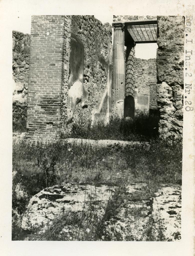 I.2.28 Pompeii. Pre-1937-39. Looking north to entrance doorway, and west side of entrance corridor.
Photo courtesy of American Academy in Rome, Photographic Archive. Warsher collection no. 1498a.