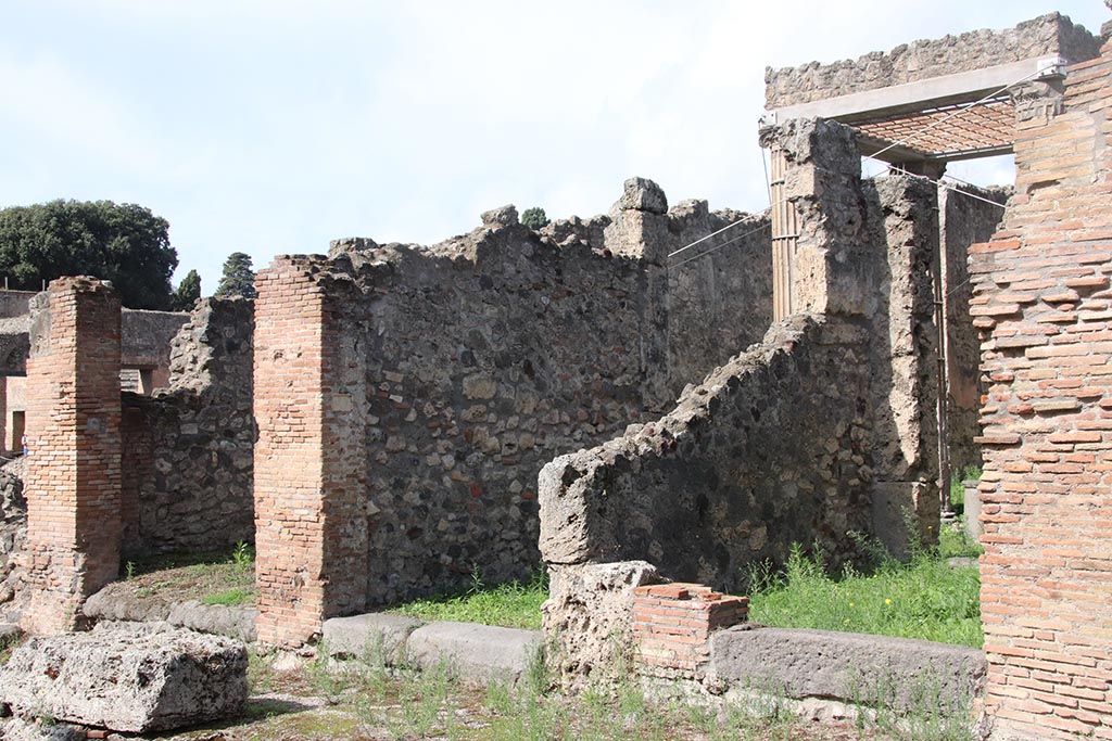 I.2.29 Pompeii, on left. October 2024. 
Looking north-west on Vicolo del Conciapelle towards doorways to I.2.29, I.2.28 and I.2.27. Photo courtesy of Klaus Heese.