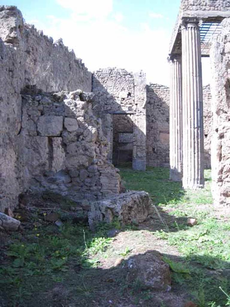 I.2.29 Pompeii. September 2010. Looking north from entrance doorway towards north wall that had a doorway into the atrium of I.2.28. 
Photo courtesy of Drew Baker.  The decorative serving table, counter or podium would have been on the left and centre of the photo. 
According to Garcia y Garcia, this bar was destroyed completely by a bomb. The perimeter walls have been reconstructed, but the three steps to the entrance, the sales counter and the electoral inscriptions have been lost forever. See Garcia y Garcia, L., 2006. Danni di guerra a Pompei. Rome: L’Erma di Bretschneider. (p.37)