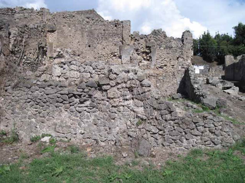 I.2.30 Pompeii. September 2010. Remains of east wall, at front of photo.
Photo courtesy of Drew Baker.