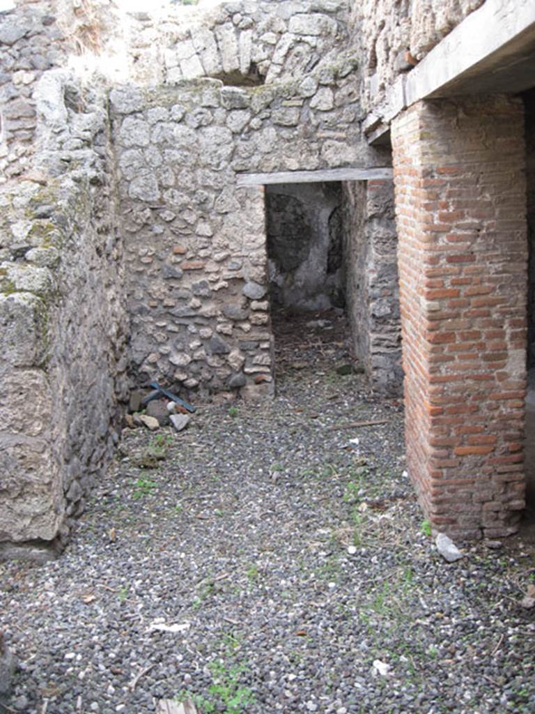 I.3.3 Pompeii. September 2010. Looking east across area of wider corridor, from north end of narrow corridor. On the left can be seen the doorway to the second triclinium, ahead is a doorway to an area that Fiorelli called “il repositorio”. On the right are the two doorways to the kitchen area.  Photo courtesy of Drew Baker