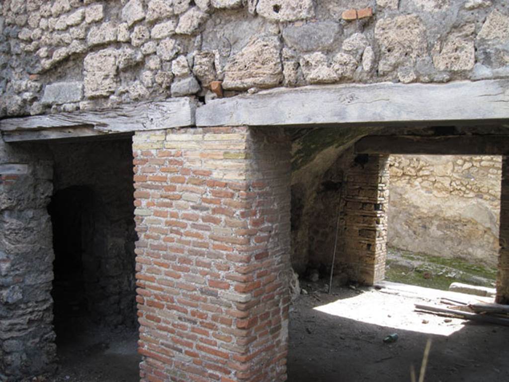 I.3.3 Pompeii. September 2010. Looking south through two doorways into kitchen area.
On the right, at the rear of the kitchen can be seen the entrance doorway at I.3.31.
Photo courtesy of Drew Baker.