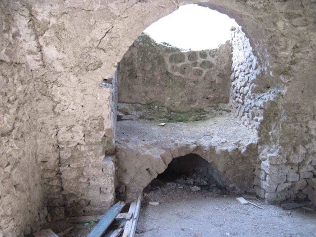 I.3.3 Pompeii. September 2010. Looking west in kitchen towards hearth in niche in south-west corner. Photo courtesy of Drew Baker. According to Mau, the smoke from the hearth passed through a window and two brick pipes buried in the vault. Mau, A: BdI, 1874, p.179