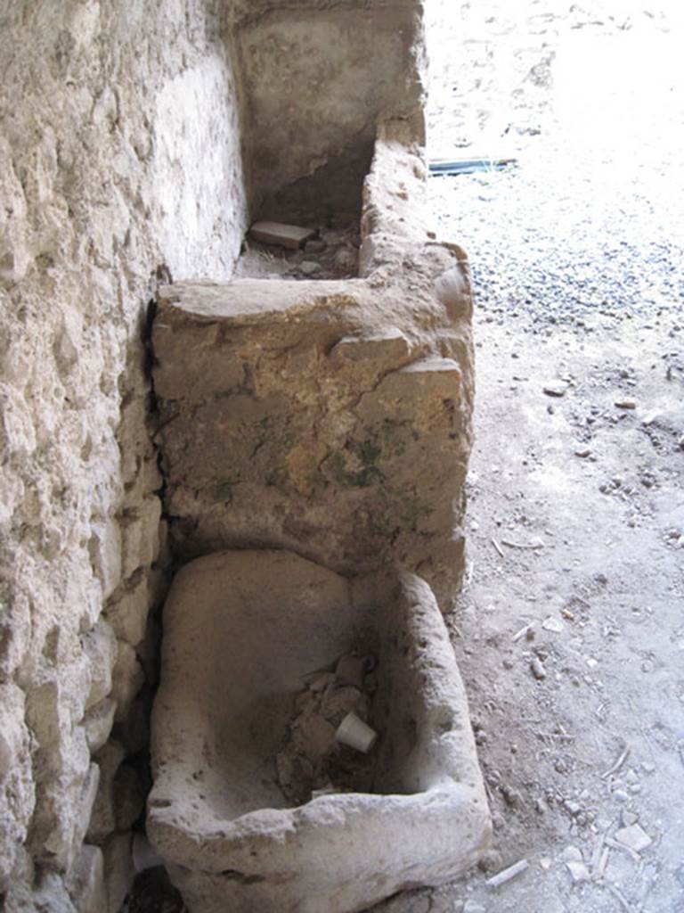 I.3.3 Pompeii. September 2010. Looking north along west wall of kitchen showing detail of bowl and basin.  Photo courtesy of Drew Baker.