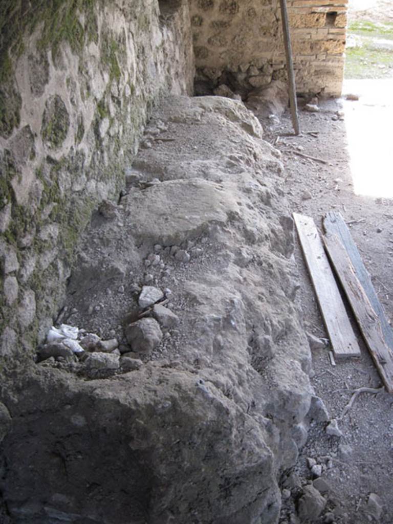 I.3.3 Pompeii. September 2010. Looking south along east wall with detail of table or bench. 
Photo courtesy of Drew Baker.