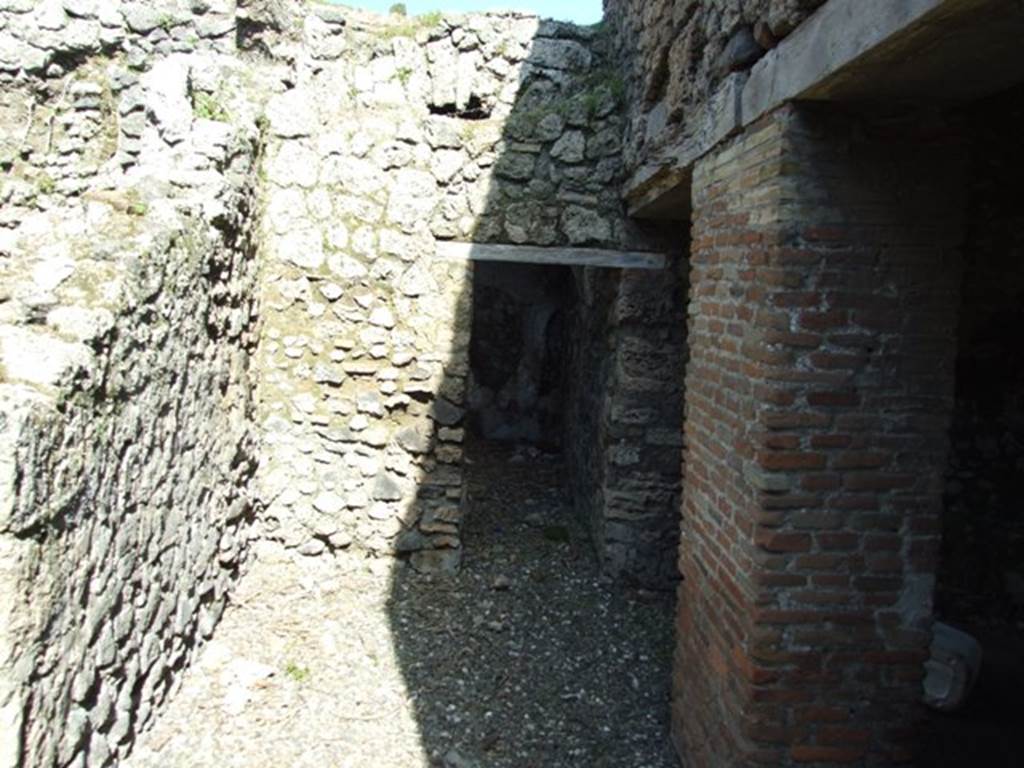 I.3.31 Pompeii. March 2009.  Looking east along wider corridor below another corridor (now collapsed) in south-west corner of upper peristyle. According to Fiorelli, the upper corridor had a sloping floor.