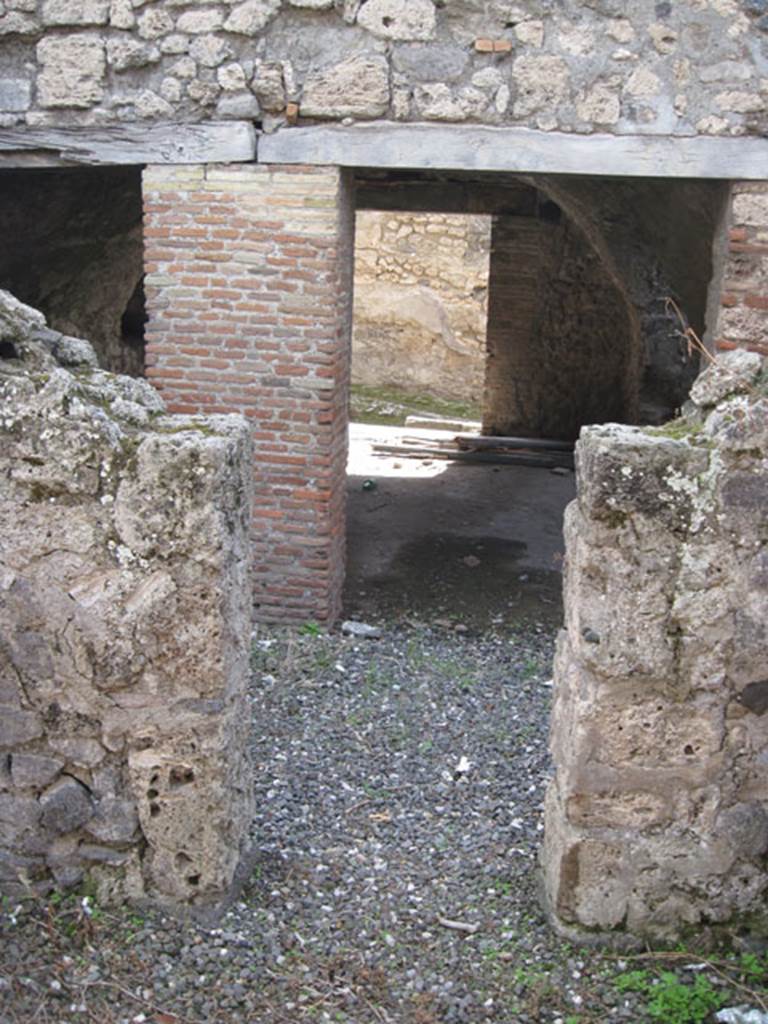 I.3.3 Pompeii. September 2010. Looking south from doorway from second triclinium, across wider corridor towards kitchen area and entrance at I.3.31. Photo courtesy of Drew Baker.