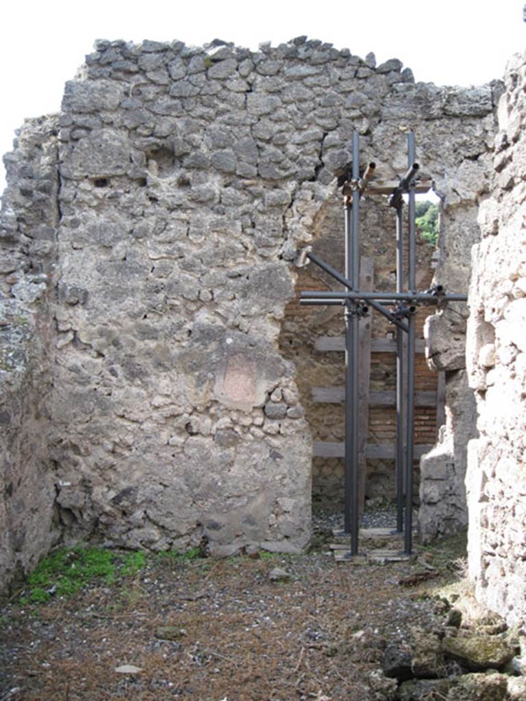 I.3.3 Pompeii. September 2010. West wall of second triclinium. Photo courtesy of Drew Baker. According to Mau, when excavated the doorway in this wall was found with a window above it. The walls of the room were decorated in black painted in the Third Style.
See Mau, A: BdI 1874, (p.178)