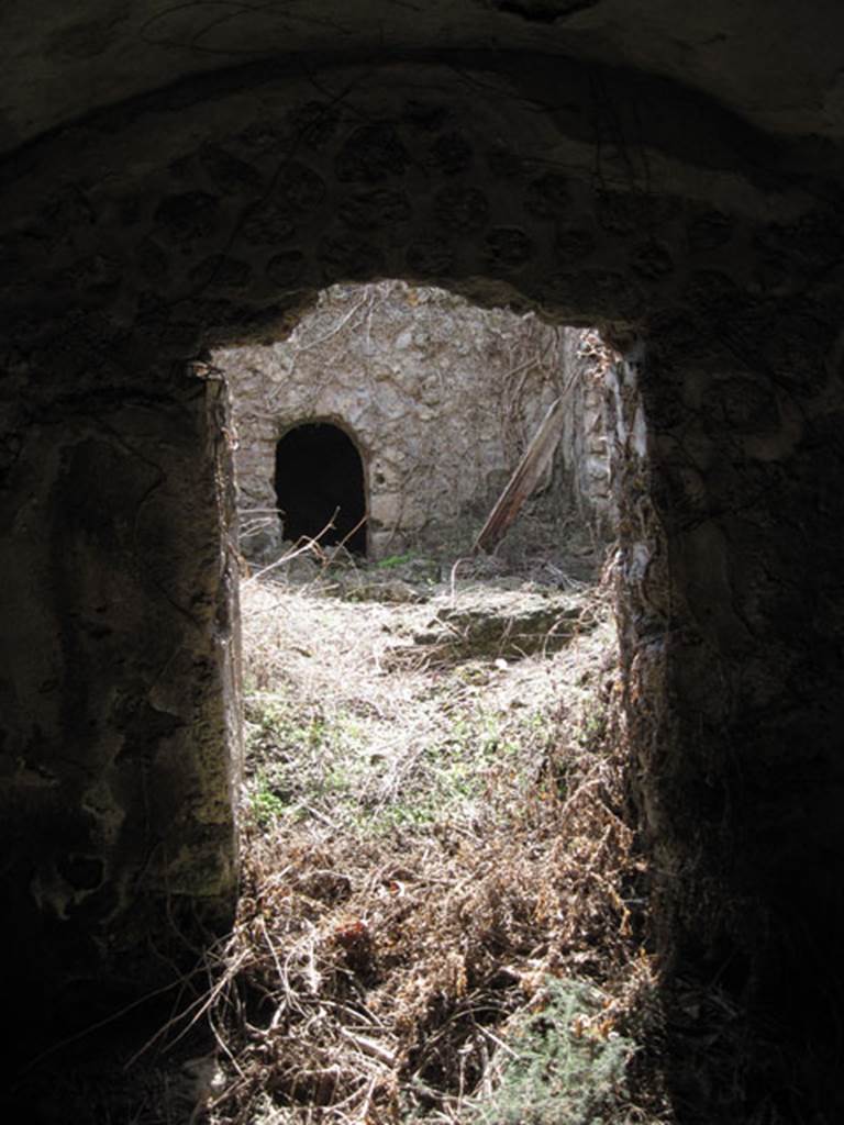 I.3.3 Pompeii. September 2010. Subterranean Level, looking south through doorway into room on east side of yard room and across to room on south side. Photo courtesy of Drew Baker.