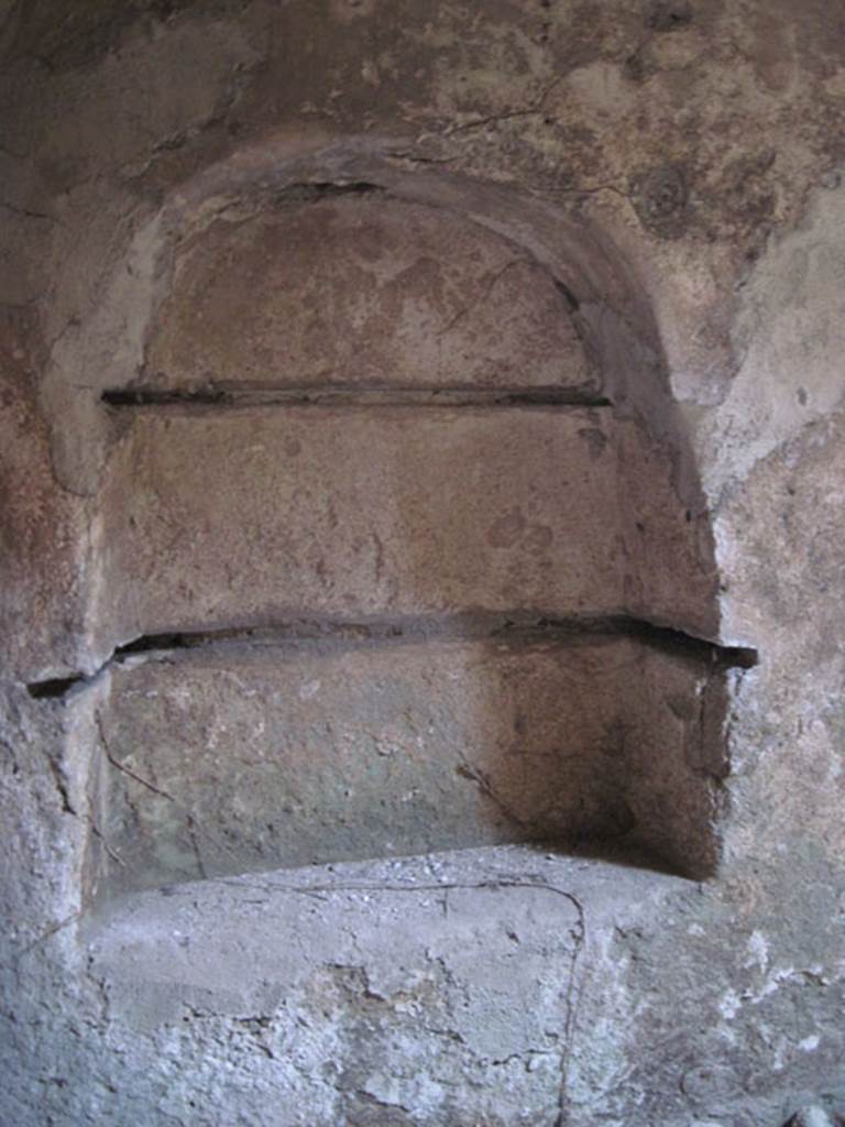 I.3.3 Pompeii. September 2010. Subterranean Level, detail of recess in north wall, with shelving slots.  Photo courtesy of Drew Baker.
