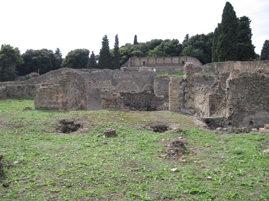 I.3.3 Pompeii. September 2010. Upper peristyle area, looking west towards room in south-west corner, collapsed rooms, stairs and yard area. Photo courtesy of Drew Baker.