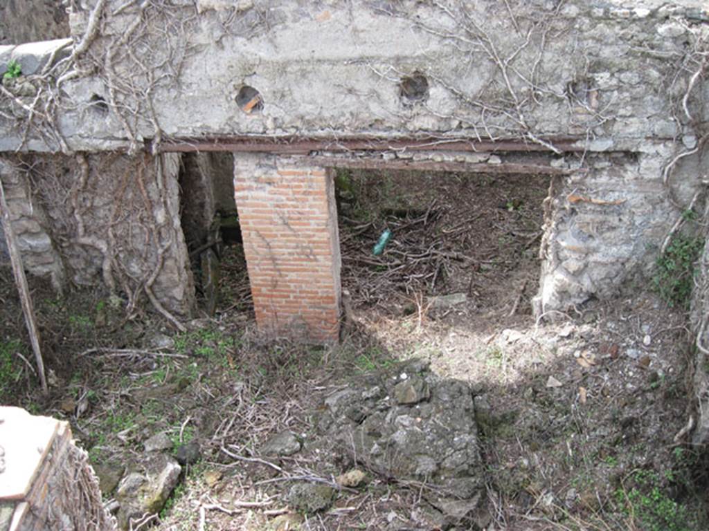 I.3.3 Pompeii. September 2010. Upper peristyle area, looking west down rooms below in collapsed area and through two doorways into the yard area of lower house.
Photo courtesy of Drew Baker.