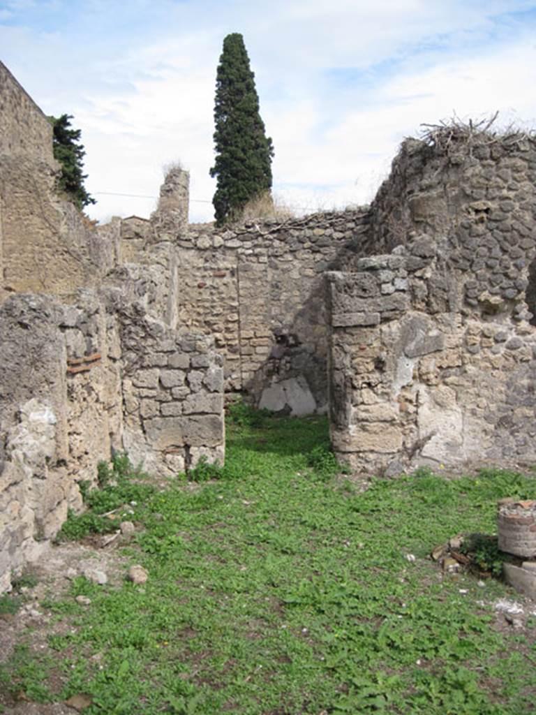 I.3.3 Pompeii. September 2010. Upper peristyle area, north-east corner of peristyle with doorway to a cubiculum in the east wall, according to Fiorelli. Photo courtesy of Drew Baker.