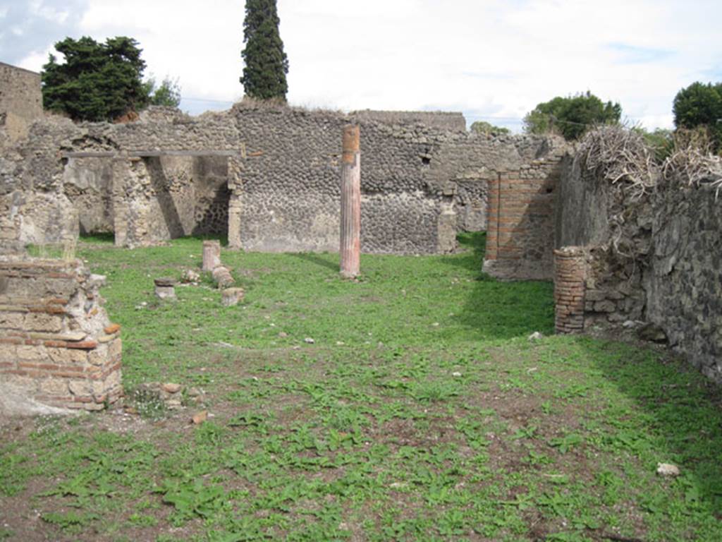 I.3.3 Pompeii. September 2010. Upper peristyle area, looking east from large exedra or triclinium onto west portico and across peristyle to south-east corner. Photo courtesy of Drew Baker.