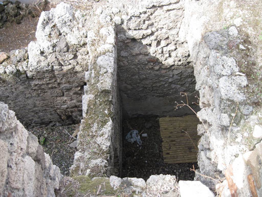 I.3.3 Pompeii. September 2010. Upper peristyle area, looking down into void to lower part of house, from doorway in north wall of exedra/triclinium. Photo courtesy of Drew Baker.