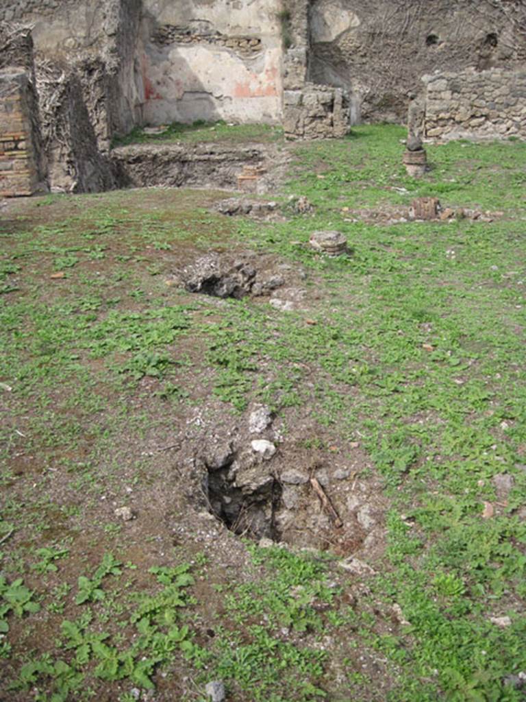 I.3.3 Pompeii. September 2010. Upper peristyle area, looking north along west portico showing view of light well holes providing illumination to lower underground rooms.
Photo courtesy of Drew Baker.