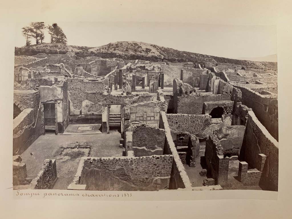 I.3.3 Pompeii. Photograph by M. Amodio, from an album dated April 1878.
Looking east across atrium, on left. The upper peristyle can be seen, centre right.
I.3.1 can be seen in lower right. Photo courtesy of Rick Bauer.