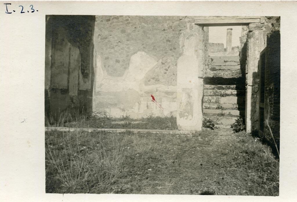 I.3.3 Pompeii, but numbered as I.2.3 on photo. 1935.  
Looking east across atrium towards tablinum and stairs leading up to the peristyle area.
Photo courtesy of American Academy in Rome, Photographic Archive. Warsher collection no. 529