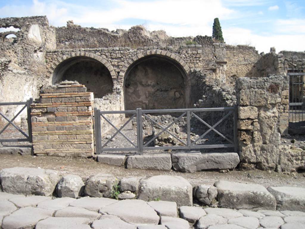 I.3.5 Pompeii. September 2010. Looking east towards entrance doorway from across the Via Stabiana. Photo courtesy of Drew Baker.
According to Warscher, quoting Fiorelli, she wrote –
I.3.5/6 – “Sono due tabernae in relazione tra loro, e perciò appartenute ad un stesso padrone. Entrambe hanno un primo compreso, separate da altro più interno, per un muro in cui è un’ampia finestra, onde ciascuno di essi prendeva luce: entrambe erano coverto da volte, di cui rimane solo la parte più interna. La prima ha nel mezzo un banco o podio di fabbrica, l’altra tiene accanto una cella, che sembra un dormitorio.” 
(translation: "These were two linked workshops joined with each other, and therefore belonged to the same owner.  Both had a front shop-room, separated by other more internal rooms, and by a wall in which was a wide window, so each room one took light from it: both were covered by a vault, but only the innermost part remained.  In the middle of the first (I.3.5) was a masonry table or podium, the other had a room, which seemed to be a dormitory."
See Warscher, T, 1935: Codex Topographicus Pompejanus, Regio I, 3:  Rome, DAIR.