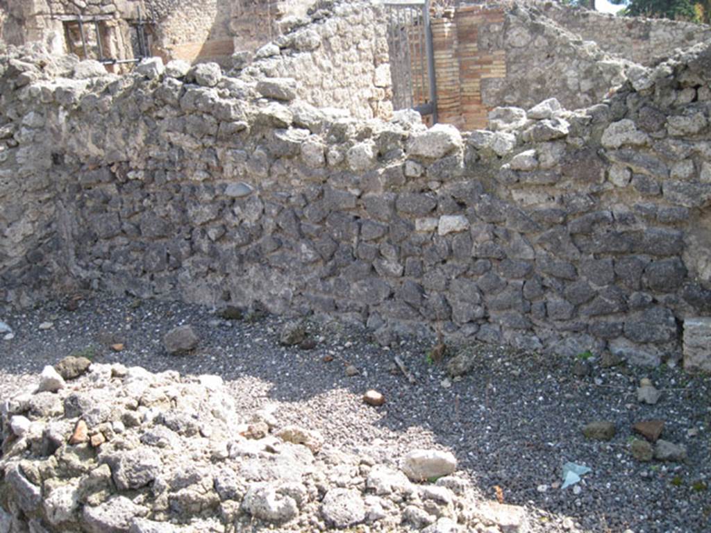 I.3.5 Pompeii. September 2010. Looking across the podium towards the south wall and south-east corner of the entrance room. Photo courtesy of Drew Baker.