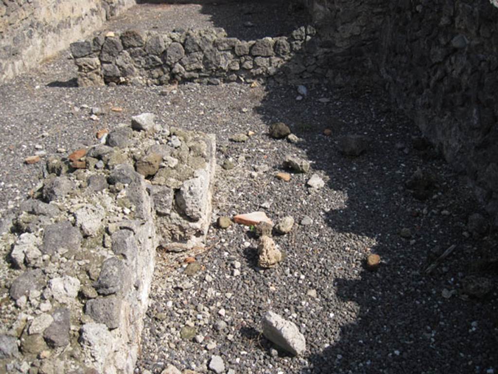 I.3.5 Pompeii. September 2010. Looking east along south side of the remains of the podium in the entrance room. Photo courtesy of Drew Baker.