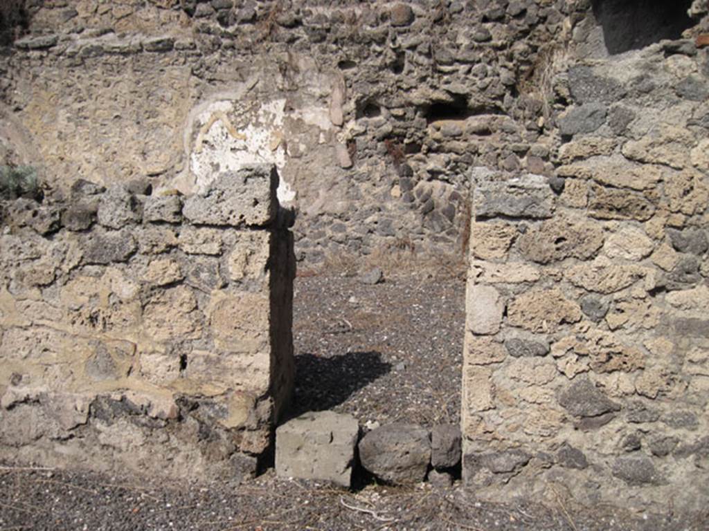 I.3.5 Pompeii. September 2010. North wall of rear vaulted room with doorway into a rear room. This room now appears to be part of I.3.6, as the north and west wall have disappeared.  Photo courtesy of Drew Baker.
