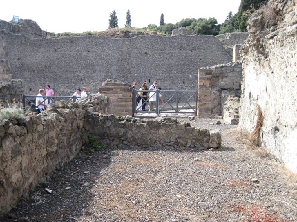 I.3.6 Pompeii. September 2010. Looking west from rear vaulted room towards via Stabiana. 
Photo courtesy of Drew Baker. According to CTP, the area towards the front of the photo would have been another room. In the centre of the photo, above the remains of the wall would have been a large window giving light to the rear room. On the north and east sides of the room would have been a wall, these are no longer visible.  See Van der Poel, H. B., 1986. Corpus Topographicum Pompeianum, Part IIIA. Austin: University of Texas.(p.6)