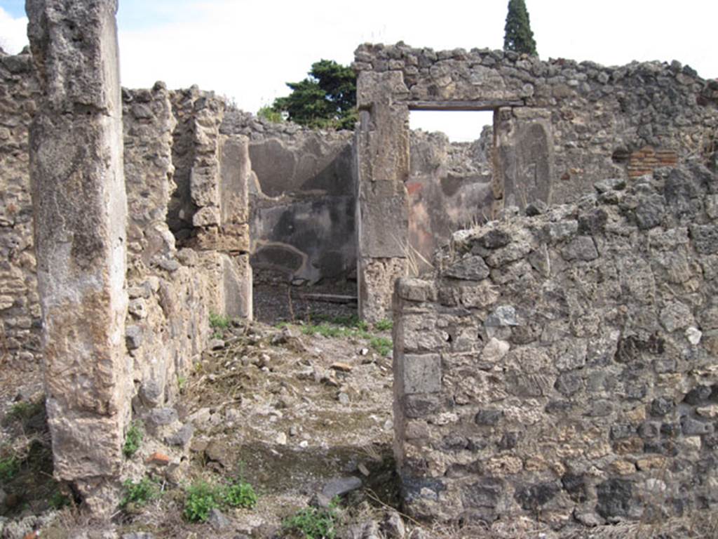 I.3.8b Pompeii. September 2010. Looking east to doorway to north-central room, looking from east portico of peristyle. According to Fiorelli, this was the doorway to the tablinum.
Photo courtesy of Drew Baker.