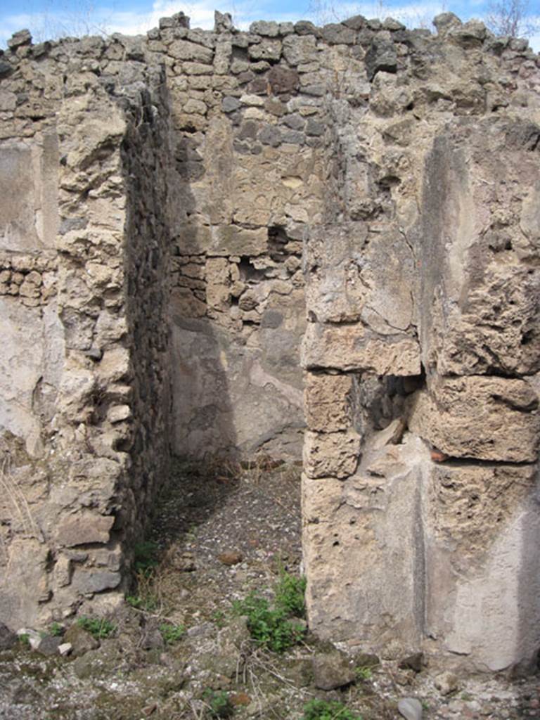 I.3.8b Pompeii. September 2010.  Looking north to doorway to small room, described by Fiorelli as l’apotheca. Photo courtesy of Drew Baker.