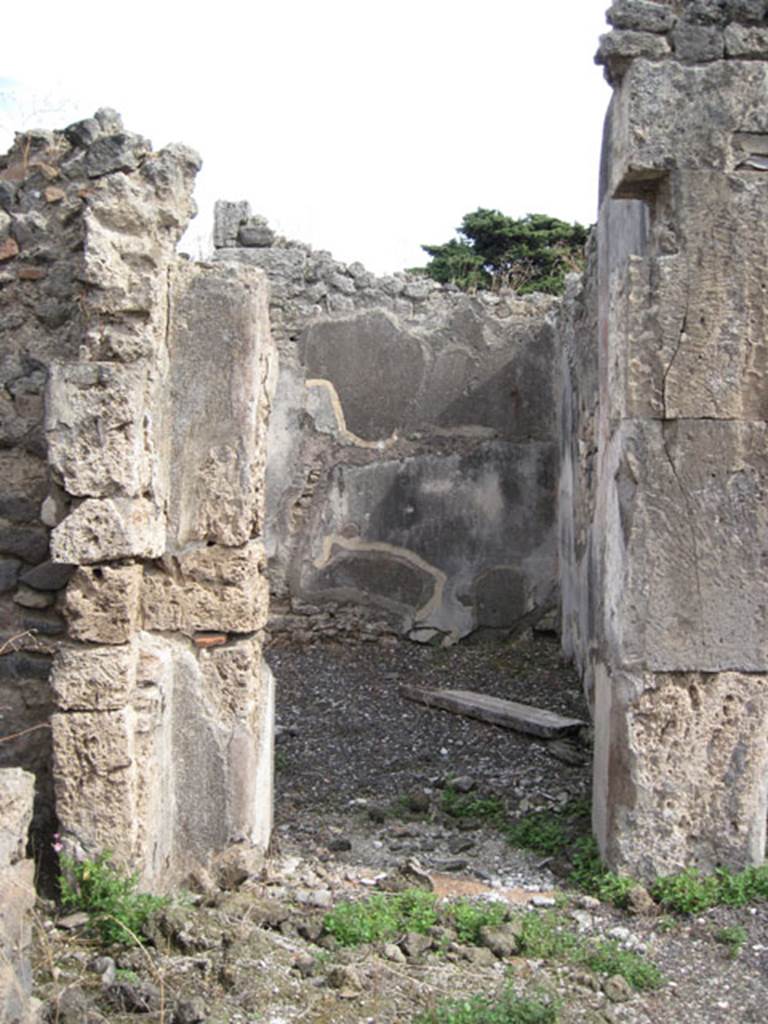 I.3.8b Pompeii. September 2010. Looking east through northern doorway in east wall of tablinum, into a triclinium. Photo courtesy of Drew Baker.