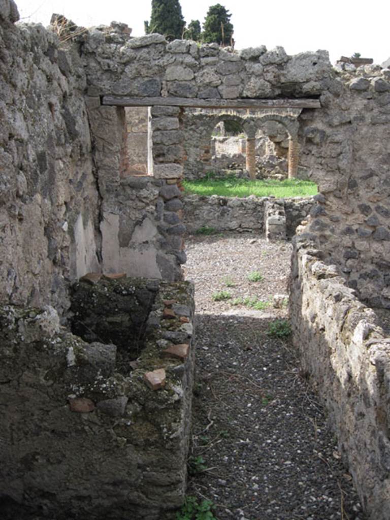 I.3.8b Pompeii. September 2010. Looking west from corridor, through south-central doorway towards east portico. Photo courtesy of Drew Baker.