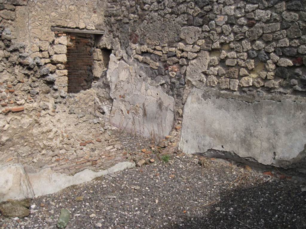 I.3.8b Pompeii. September 2010. Looking towards north-east corner, showing partition wall and blocked doorway or window aperture of cubiculum, in relationship to this room. Photo courtesy of Drew Baker.