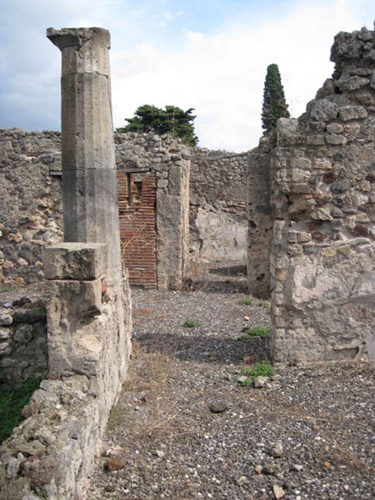I.3.8b Pompeii. September 2010. Looking east across south portico from exedra, the large window from the garden area can be seen on the left. Photo courtesy of Drew Baker.