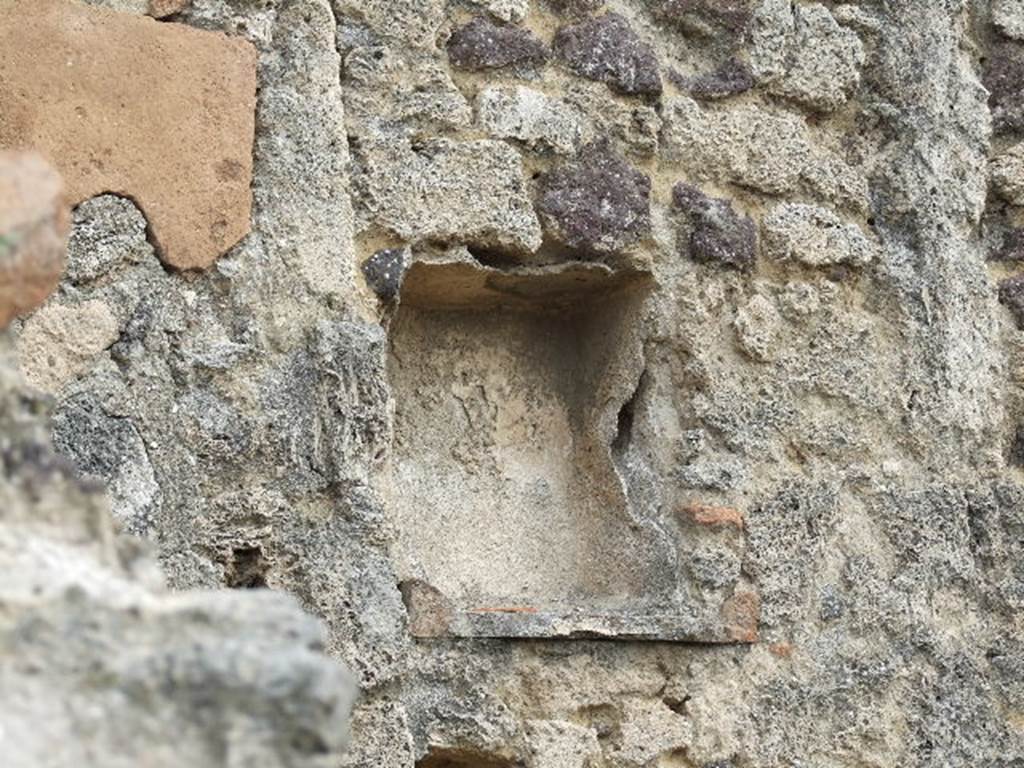 I.3.8a Pompeii. December 2006. Niche in east wall. According to Boyce, this rectangular niche was to be found in the east wall of the kitchen, above the hearth. Its walls were coated with successive layers of plaster.
See Boyce G. K., 1937. Corpus of the Lararia of Pompeii. Rome: MAAR 14. (p.24, no.21)