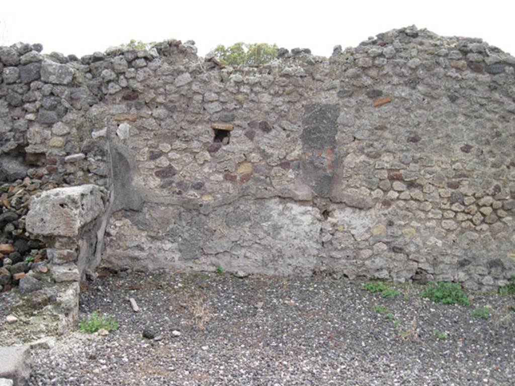 I.3.9 Pompeii. September 2010. South wall of entrance room and south-east corner.
This area would have been linked to area of I.3.10. On the left, the doorway to the first rear room can be seen. Photo courtesy of Drew Baker.