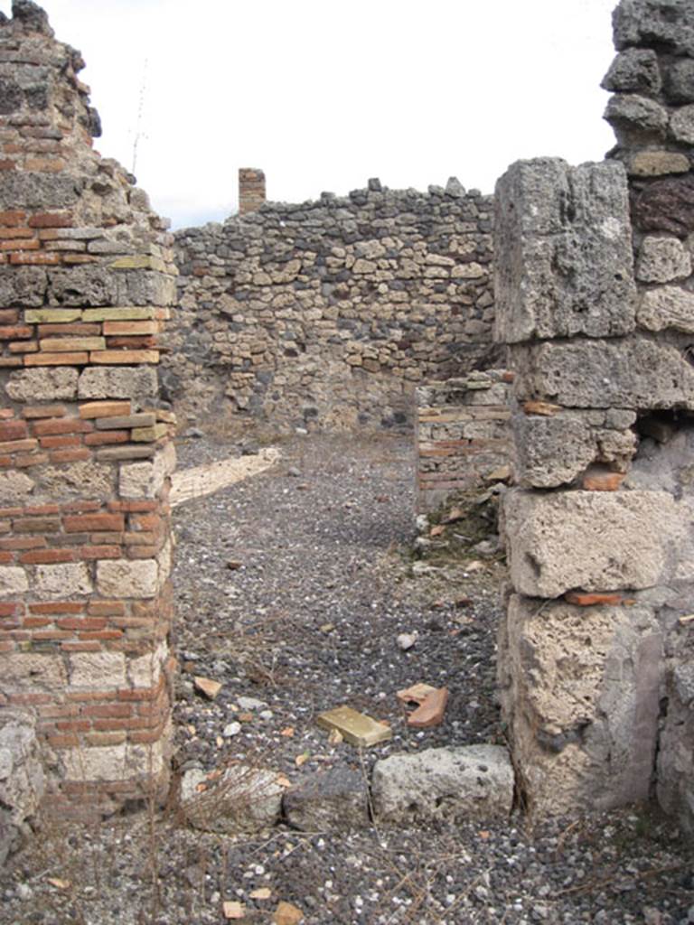 I.3.10 Pompeii. September 2010. Looking east towards doorway from room with tubs and furnaces, towards rear of property. Photo courtesy of Drew Baker
