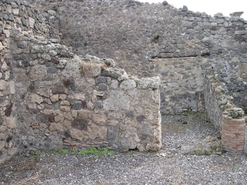 I.3.10 Pompeii. September 2010. Looking south to doorway to eastern room in south-east corner.  Note blocked up doorway leading to I.3.8b. Photo courtesy of Drew Baker.